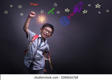 Kid's learning inspiration world in science education with girl child's imagination doodle on teacher's school chalkboard for back to school month and international or universal children's day concept - Powered by Shutterstock