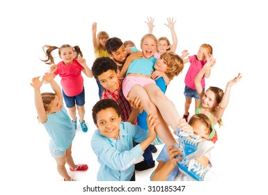 Kids Lifting Popular Classmate And Cheering