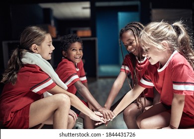 Kids At The Locker Room Building Up Spirit Of Togetherness Before The Match. Children Team Sport