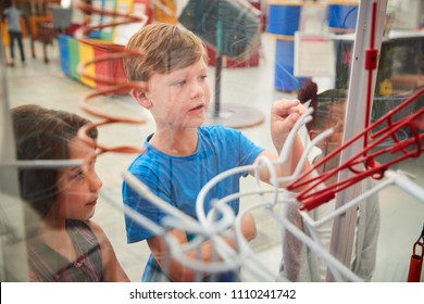 Kids Looking Through Glass At A Science Exhibit, Close Up