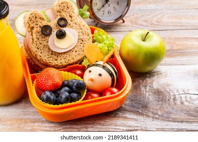 Kids Lunch Box With Funny Bear Sandwich And Boiled Egg Bee, Apple, Orange Juice. Back To School Background. Copy Space