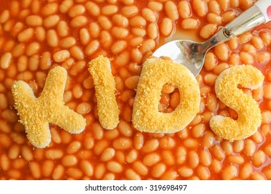 Kids Meal - The Word KIDS Written In Breadcrumbs On Baked Beans In Tomato Sauce