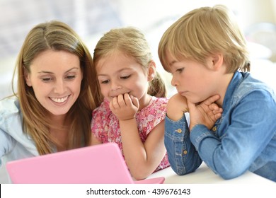 Kids With Mom Playing On Laptop Computer