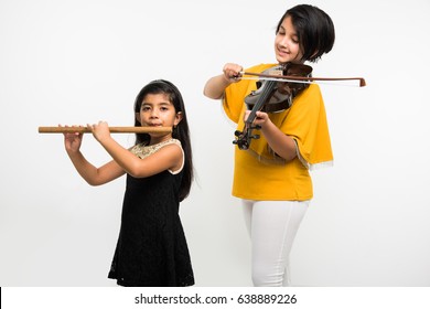 Kids and music concept - Cute little Indian kids playing musical instruments as a team or band, Over white background