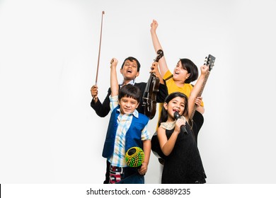 Kids And Music Concept - Cute Little Indian Kids Playing Musical Instruments As A Team Or Band, Over White Background