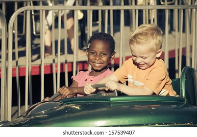 Kids On An Amusement Park Ride