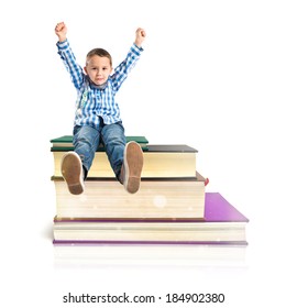 Kids On Several Books Isolated Over White Background 