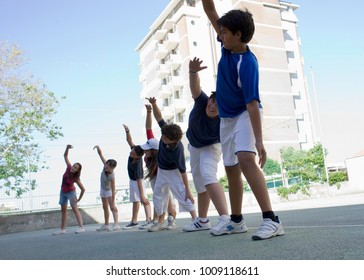 Kids On A Soccaryard Doing Warmup