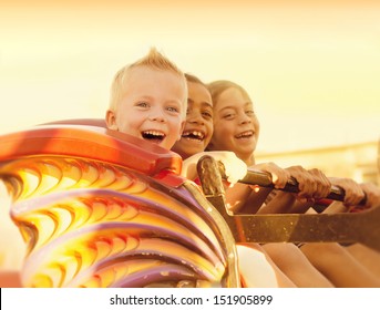 Kids on a Summertime Roller Coaster Ride - Powered by Shutterstock