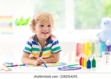 Kids paint  Child painting in white sunny study room  Little boy drawing rainbow  School kid doing art homework  Arts   crafts for kids  Paint children hands  Creative little artist at work 