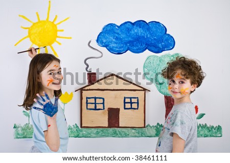Kids painting on wall