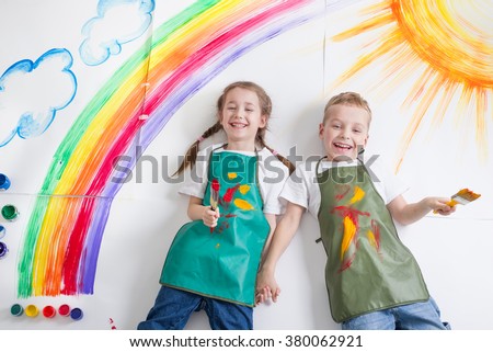 kids painting rainbow