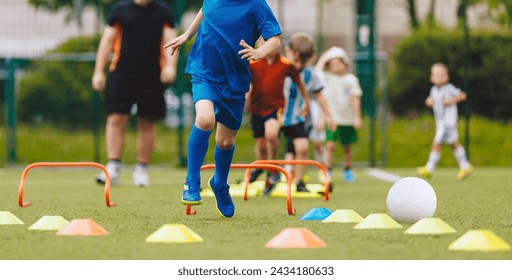 Kids in physical education training. Children play sports drill on training equipment - Powered by Shutterstock