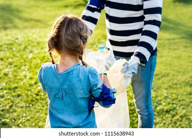 Kids Picking Up Trash In The Park