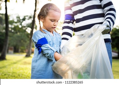 Kids Picking Up Trash In The Park