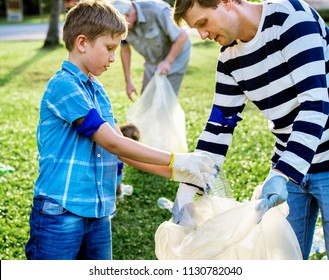 Kids Picking Up Trash In The Park