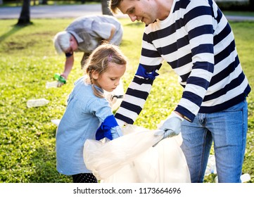 Kids Picking Up Trash In The Park