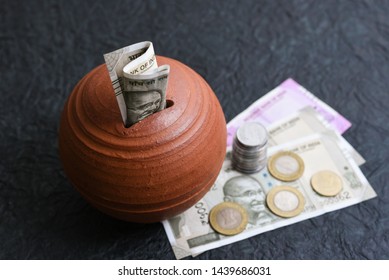 Kids Piggy Bank Or Coin  Stack Jar For Money Savings Cash Deposit For Future. 500 Rupee Banknote India. Success And Profit From Business. 500, 2000, New Indian Currency Notes.