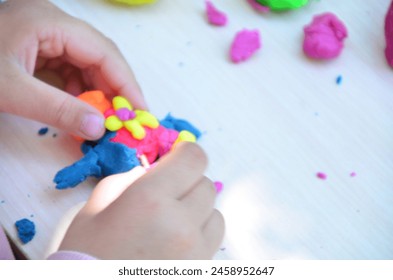 kids play with clay molding shapes, learning through play. Plasticine. dough for play. Girl molding modeling clay. Homemade clay. children's creativity, early development, fine motor skills. - Powered by Shutterstock