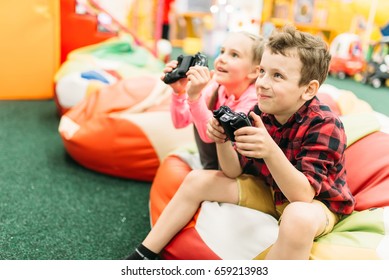 Kids Play In A Games Console, Happy Childhood