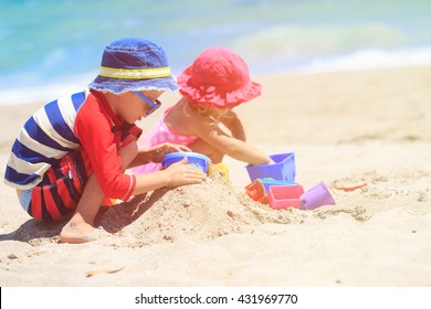 Kids Play With Sand On Summer Beach