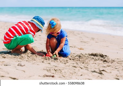 Kids Play With Sand On Summer Beach