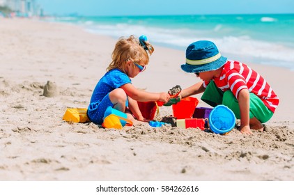 Kids Play With Sand On Summer Beach