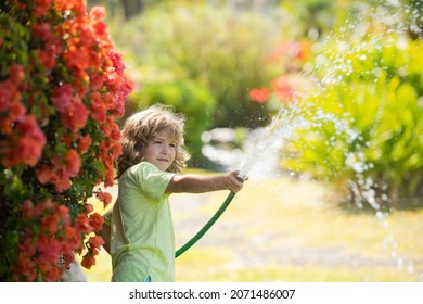 Kids Play With Water Garden Hose In Yard. Outdoor Children Summer Fun. Little Boy Playing With Water Hose In Backyard. Party Game For Children. Healthy Activity For Hot Sunny Day.