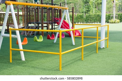 Kids Playground At The Park With Artificial Grass