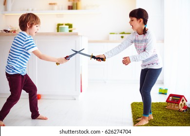 kids playing active fight games at home kitchen