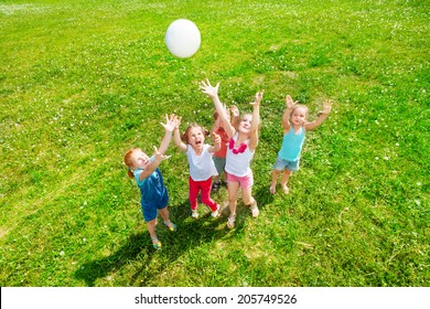 Kids playing ball on a meadow