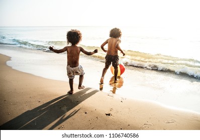 Kids Playing At The Beach