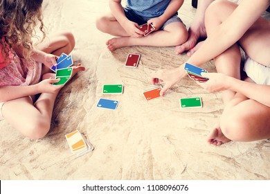 Kids Playing Cards On The Floor