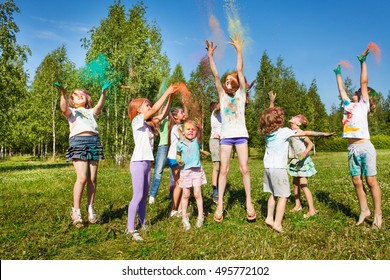 Kids Playing With Colored Powder At Outdoor Fest