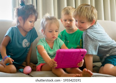 Kids Playing Games And Watching Tv On Electronic Devices.