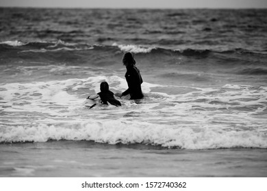 Kids Playing On The Beach