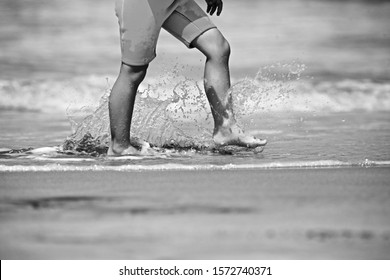 Kids Playing On The Beach