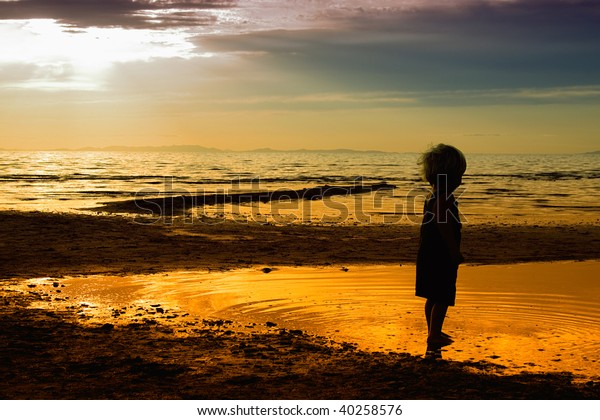Kids Playing On Beach Silhouette Shot Stock Photo (Edit Now) 40258576