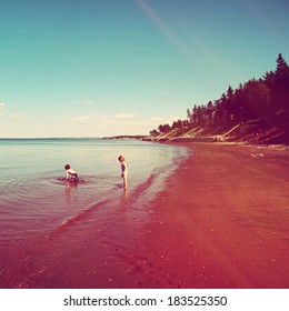 Kids Playing On The Beach In Water - Instagram Effect 