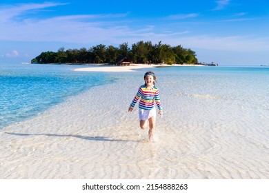 Kids Playing On Tropical Beach. Children Swim And Play At Sea On Summer Family Vacation. Sand And Water Fun, Sun Protection For Young Child. Little Boy And Girl Running And Jumping At Ocean Shore.