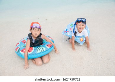 Kids Playing In The Sea