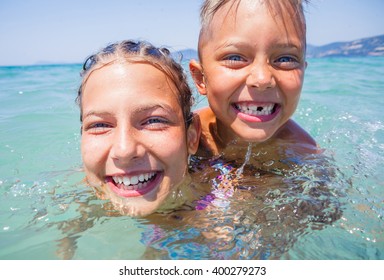 Kids playing in sea. 