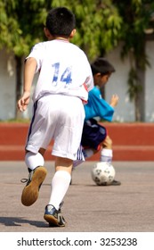 Kids Playing Soccer.