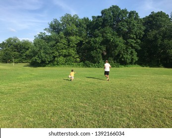 Kids Playing Soccer With Dad/Coach