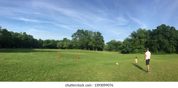 Kids Playing Soccer With Dad/Coach