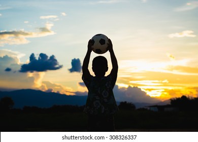 Kids Are Playing Soccer Football For Exercise Under The Sunlight.