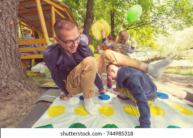 Kids Playing Twister Game Outdoors