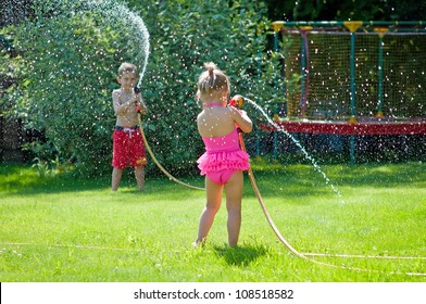 5,429 Kids playing sprinkler Stock Photos, Images & Photography ...