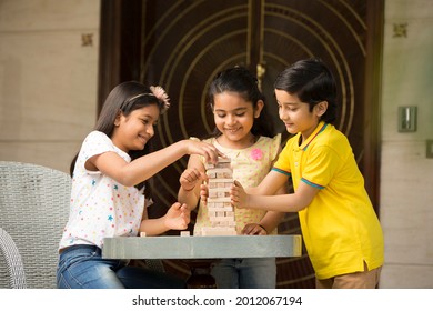 Kids Playing Wood Blocks Game At Home