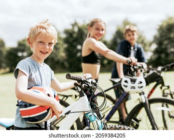 Kids riding bikes, enjoying summer holiday